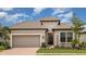 Charming home with a tile roof, two-car garage, and well-manicured landscaping at 26836 Dove Dr, Punta Gorda, FL 33955