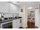 Wet bar area includes a beverage fridge, white cabinets and leads to a well-stocked pantry at 3301 Bayshore Blvd # 1908B, Tampa, FL 33629