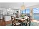 Open dining room showcasing a waterfront view, a dazzling chandelier, and bright, white kitchen at 3301 Bayshore Blvd # 1908B, Tampa, FL 33629
