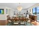 Light-filled dining room with waterfront view complemented by hardwood floors and neutral color palette at 3301 Bayshore Blvd # 1908B, Tampa, FL 33629