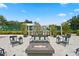 Outdoor grilling area with multiple grills, seating, and a cozy fire pit for entertaining at 3301 Bayshore Blvd # 1908B, Tampa, FL 33629