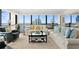 Inviting living room boasts plush seating, large windows showcasing city and water views, and chic decor at 3301 Bayshore Blvd # 1908B, Tampa, FL 33629