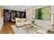 Cozy living room with comfortable seating, a large bookcase, and elegant decor at 3301 Bayshore Blvd # 1908B, Tampa, FL 33629