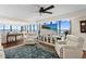 Comfortable living room with recliners, a ceiling fan and a beach scene on the large screen television at 3301 Bayshore Blvd # 1908B, Tampa, FL 33629