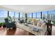 Bright living room boasts hardwood floors, large windows with waterfront views, and comfortable seating at 3301 Bayshore Blvd # 1908B, Tampa, FL 33629