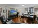 Well-lit office space with hardwood flooring, a large desk, and a comfortable seating area at 3301 Bayshore Blvd # 1908B, Tampa, FL 33629