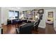 Bright office featuring a built-in bookshelf, hardwood floors, and large windows with scenic views at 3301 Bayshore Blvd # 1908B, Tampa, FL 33629
