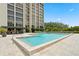 Enjoy the building pool with plenty of seating outside the residence at 3301 Bayshore Blvd # 1908B, Tampa, FL 33629