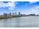 A scenic waterfront view featuring the city skyline under a bright, blue sky at 3301 Bayshore Blvd # 1908B, Tampa, FL 33629