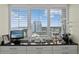 A stunning view from the vanity window showcases a high-rise and serene ocean, framed by white shutters at 3301 Bayshore Blvd # 1908B, Tampa, FL 33629