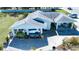 Home with ample parking, carport, and manicured landscaping creating curb appeal at 4010 N Lockwood Ridge Rd, Sarasota, FL 34234