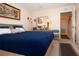Calm bedroom with a comfortable bed and a view of a private bathroom entrance at 4010 N Lockwood Ridge Rd, Sarasota, FL 34234