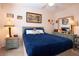 Bright bedroom showcasing a well-made bed and matching dresser with a stylish mirror at 4010 N Lockwood Ridge Rd, Sarasota, FL 34234