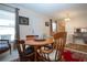 Cozy dining area featuring a wooden table, chairs, and a bright front door at 4010 N Lockwood Ridge Rd, Sarasota, FL 34234