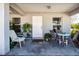 Charming front porch featuring a cozy seating area and an inviting entrance at 4010 N Lockwood Ridge Rd, Sarasota, FL 34234