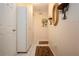 Hallway with storage cabinets, neutral paint, and tile flooring at 4010 N Lockwood Ridge Rd, Sarasota, FL 34234