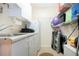 A storage area or laundry room with white cabinets and shelves at 4010 N Lockwood Ridge Rd, Sarasota, FL 34234