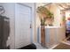 Well-lit laundry room featuring a washer and dryer, adjacent to a utility door, with a water heater nearby at 4010 N Lockwood Ridge Rd, Sarasota, FL 34234