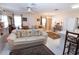 Comfortable living room features tile flooring, an adjacent kitchen and ample seating at 4010 N Lockwood Ridge Rd, Sarasota, FL 34234