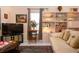 Cozy living room with a flat screen TV, display shelves, and comfortable seating at 4010 N Lockwood Ridge Rd, Sarasota, FL 34234