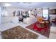 Bright living space with an open kitchen, comfortable seating, and a cozy dining area at 4010 N Lockwood Ridge Rd, Sarasota, FL 34234