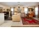 Bright living room with a ceiling fan, display shelves, and neutral paint at 4010 N Lockwood Ridge Rd, Sarasota, FL 34234