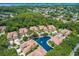 Townhome community with manicured lawns and a calming fountain pond at 4224 Preserve Pl, Palm Harbor, FL 34685