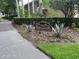 Entrance to The Preserve at Lansbrook with lush landscaping and attractive community signage at 4224 Preserve Pl, Palm Harbor, FL 34685