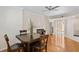Inviting dining area with wood floors, fireplace, and sliding glass doors to the outside at 4224 Preserve Pl, Palm Harbor, FL 34685