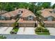 Beautifully landscaped, two-story townhome with a two-car garage and well-maintained lawn at 4224 Preserve Pl, Palm Harbor, FL 34685