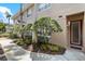 Well-maintained townhome exterior with manicured landscaping and a welcoming entrance at 4224 Preserve Pl, Palm Harbor, FL 34685