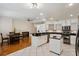 Bright kitchen with stainless steel appliances, an island, and an adjacent dining and Gathering area at 4224 Preserve Pl, Palm Harbor, FL 34685