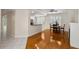 Open floor plan features hardwood floors and views into the kitchen, dining, and outdoor spaces at 4224 Preserve Pl, Palm Harbor, FL 34685
