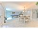 Expansive living room featuring a dining area, pool table, and easy access to outdoor spaces at 4810 Centerbrook Ct, Tampa, FL 33624