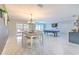 Large living room with a pool table, dining area, and sliding glass doors to the outdoors at 4810 Centerbrook Ct, Tampa, FL 33624