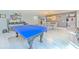 Recreational area with a ping pong table, dining table, and bar setup, perfect for entertaining at 4810 Centerbrook Ct, Tampa, FL 33624