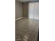 Bright and airy empty room with neutral walls and tiled flooring, featuring a large window at 5507 Riddle Rd, Holiday, FL 34690