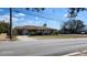 Charming single-story house with well-kept lawn, mature trees, and accessible street parking at 5507 Riddle Rd, Holiday, FL 34690
