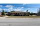 Charming single-story home featuring a well-maintained lawn and a driveway at 5507 Riddle Rd, Holiday, FL 34690