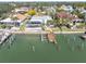 Waterfront home featuring a private dock, screened pool, lush landscaping and canal access at 5836 Skimmer Point S Blvd, Gulfport, FL 33707