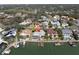 Aerial view of the property showcasing the backyard, pool, boat dock, and neighborhood at 5836 Skimmer Point S Blvd, Gulfport, FL 33707