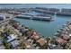 Aerial view of the property's neighborhood and community, on the water near a marina and other residences at 5836 Skimmer Point S Blvd, Gulfport, FL 33707