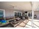 Relaxing covered lanai boasting ceiling fans, outdoor furniture and sliding glass doors to the interior at 5836 Skimmer Point S Blvd, Gulfport, FL 33707