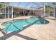 Screened-in outdoor pool and patio area perfect for entertaining and enjoying the outdoors at 5836 Skimmer Point S Blvd, Gulfport, FL 33707
