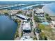 An aerial view of a waterfront property with a pool, marina, beach, and other amenities nearby at 611 Destiny Dr # 604, Ruskin, FL 33570