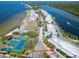 Scenic aerial view of the buildings and tennis courts by the water at 611 Destiny Dr # 604, Ruskin, FL 33570