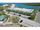Exterior view of the condo building with well-maintained landscaping and parking at 611 Destiny Dr # 604, Ruskin, FL 33570
