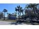 Charming community building surrounded by palm trees, lush lawns and landscaping creating a tranquil and inviting atmosphere at 611 Destiny Dr # 604, Ruskin, FL 33570