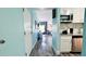A bright and airy living space with a modern kitchenette, desk area, and comfortable seating at 611 Destiny Dr # 604, Ruskin, FL 33570
