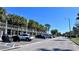 View of the parking area with palm trees and car parking at 611 Destiny Dr # 604, Ruskin, FL 33570